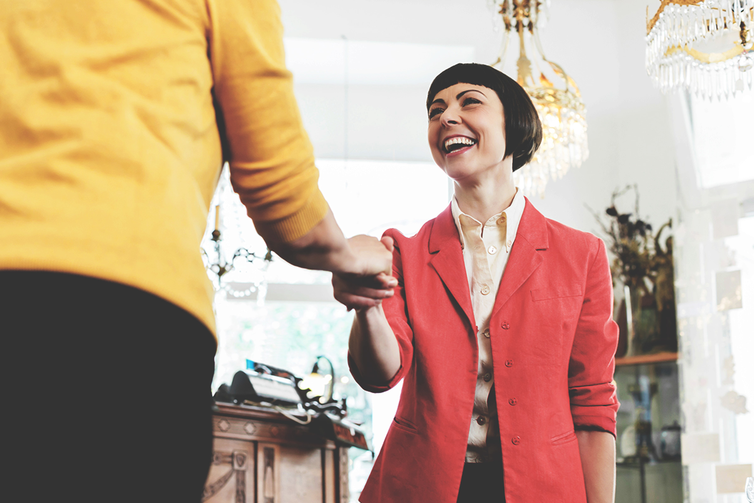 Female real estate agent greets client