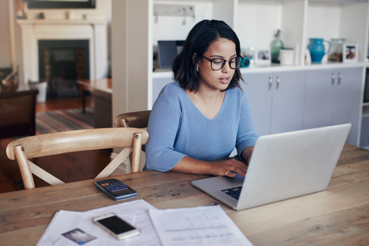 Woman working on her laptop.