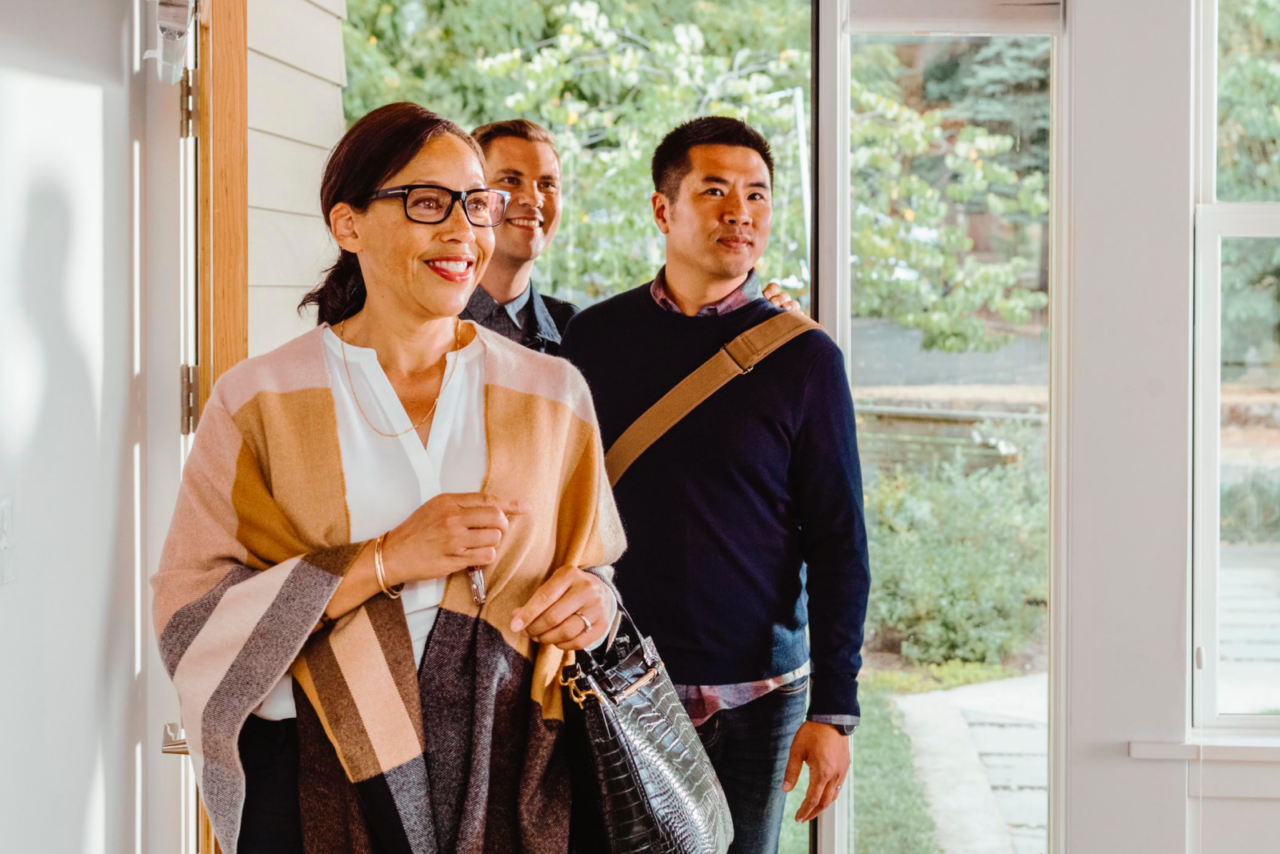 Agent showing buyers a property