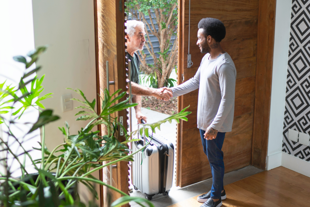 People greeting each other in a doorway