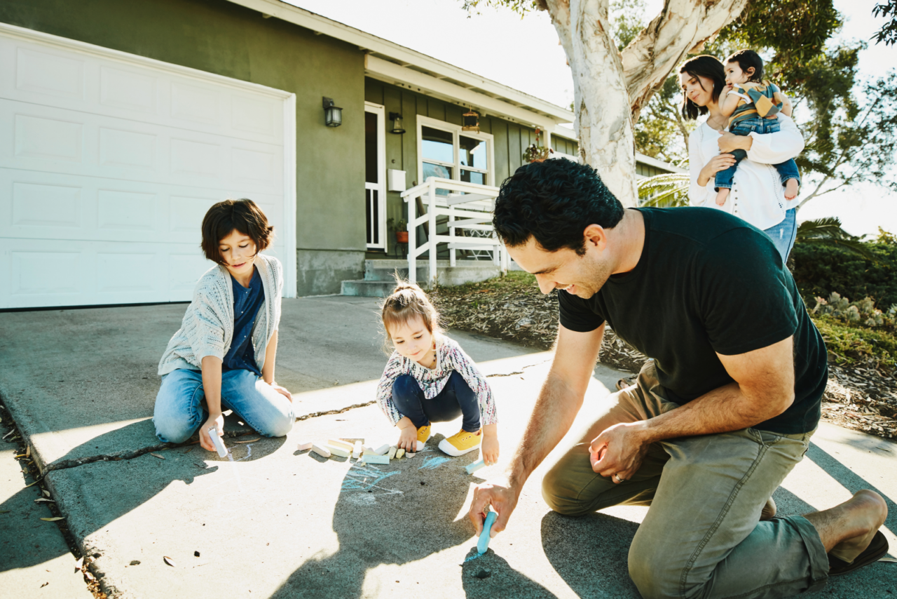 Family playing outside their home