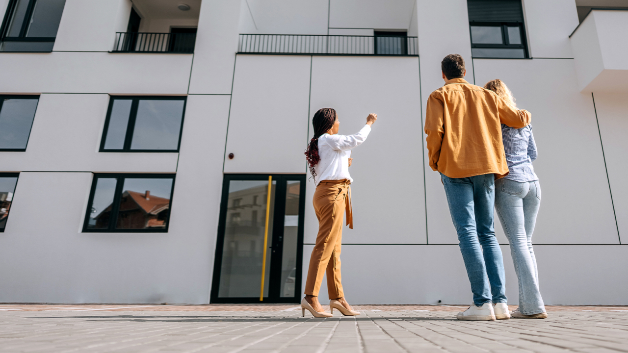 people looking at apartment building