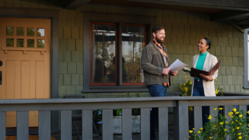 real estate agent at house