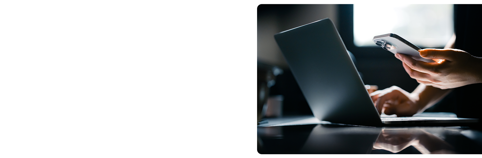 person on computer and phone