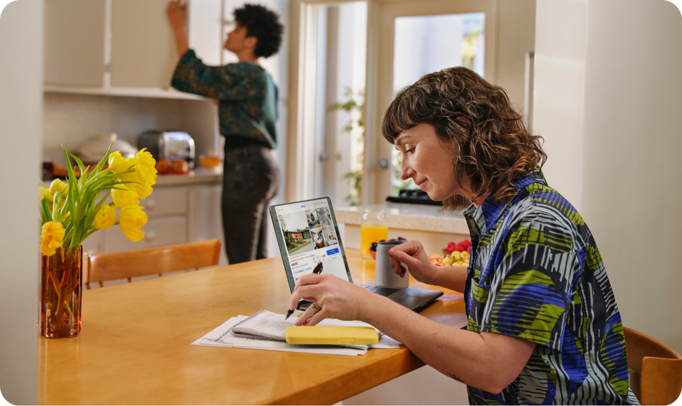 woman looking at properties on computer