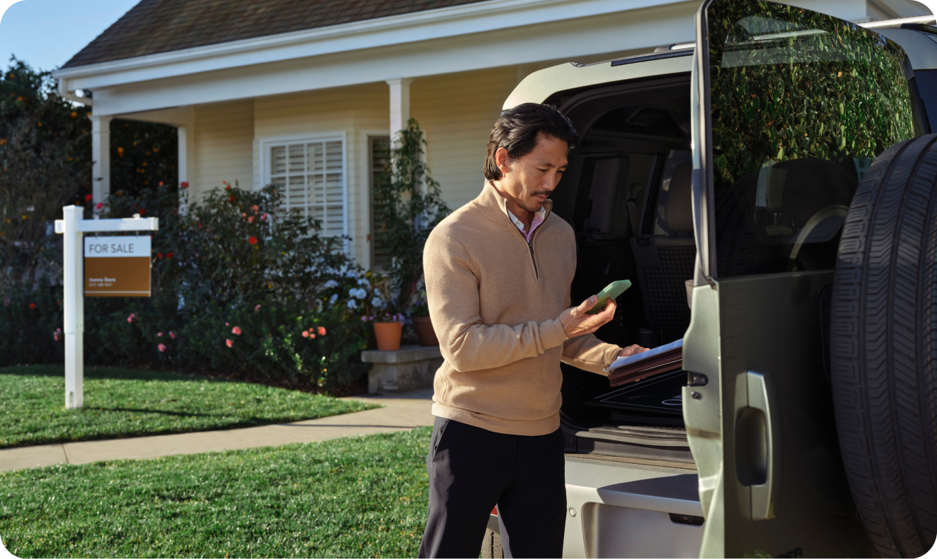 Man outside of house for sale