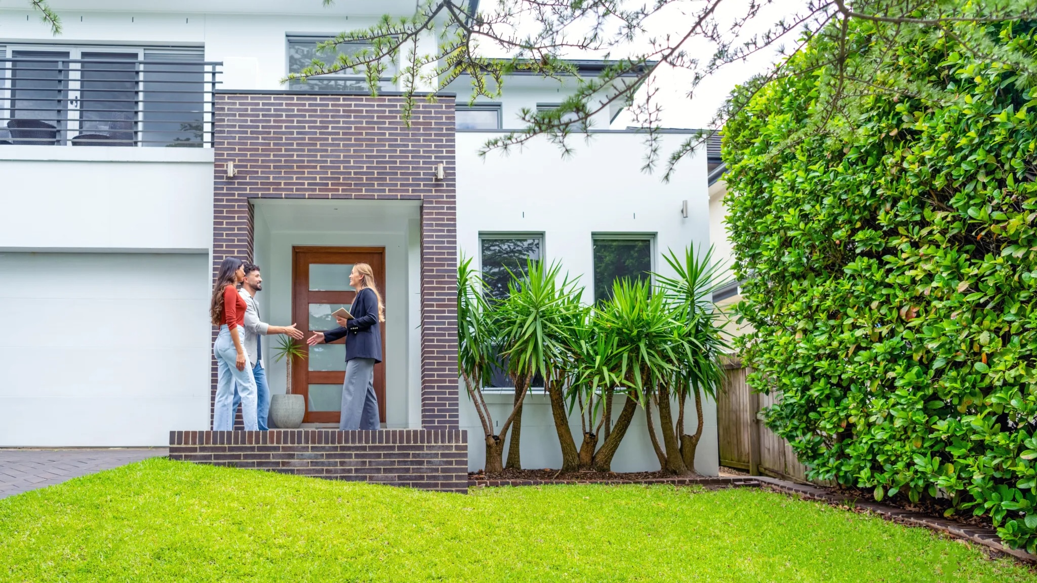 people outside of a home with an agent