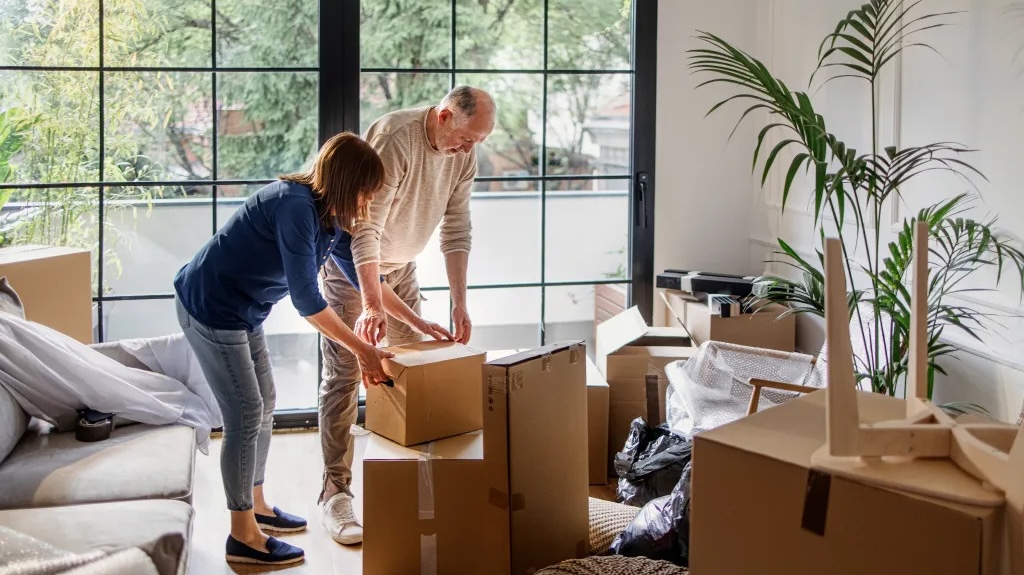 man and woman with moving boxes