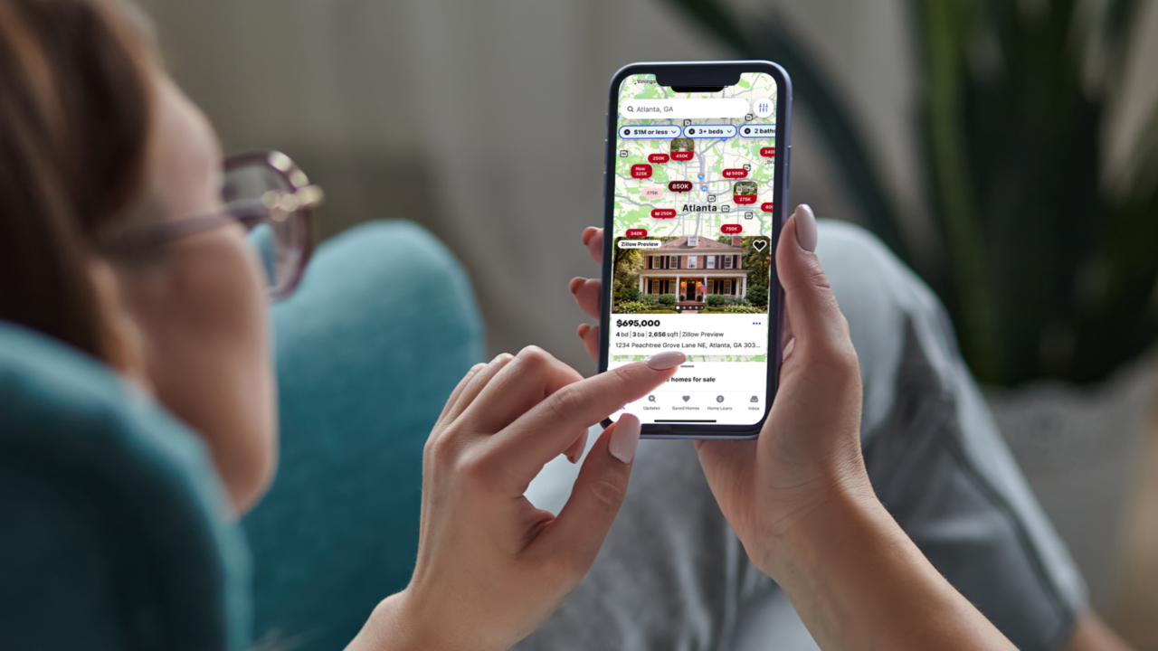person using zillow preview on their phone