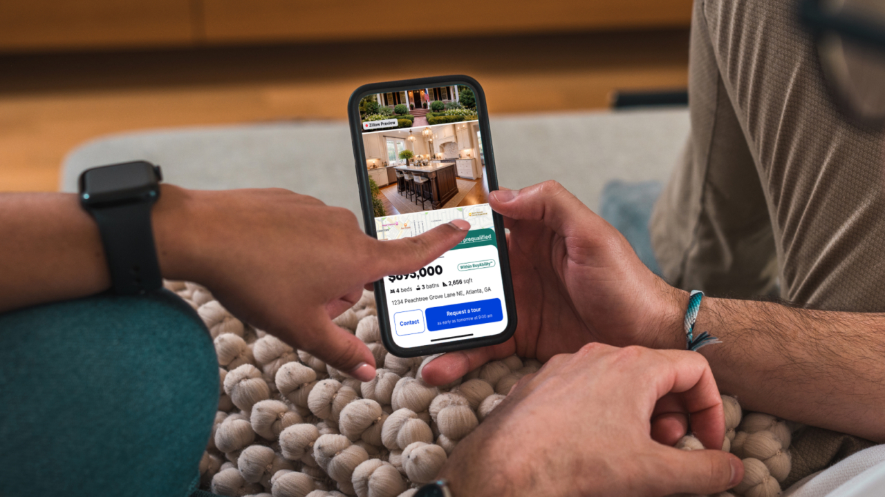 person using zillow preview on their phone