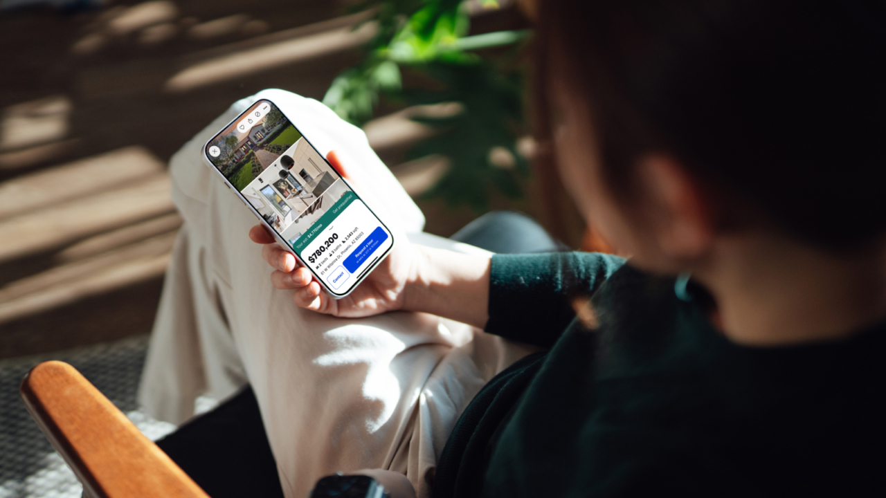 person looking at zillow listing